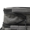 A grey expanding cooler with zippers and compartments for storage. Features a sleek, modern design.