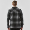 A men's black and grey plaid shacket with a classic collar and back yoke detailing. Features a logo on the fabric.