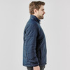 A navy blue puffer jacket with a collar, featuring a side profile view of a man wearing it.