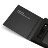 A black power bank housed in a sleek box, featuring a USB cable and branding.