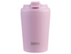 A ceramic-lined insulated coffee cup in light pink, featuring a secure lid and a branding logo.