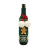 A drink bottle with a green knitted sleeve featuring a gingerbread man, white snowflakes, and pom-pom decorations.