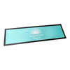 A bar runner featuring a turquoise background with a black border and a logo in the centre.