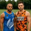 Two men stand side by side wearing contrasting sports singlets: one in blue with a pattern and the other in orange camouflage.