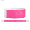 A neon pink Tyvek adult wristband, featuring a brand logo and a textured white section.