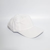 A white denim cotton baseball cap with a buckle strap and a logo on the side.