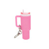 A pink mini tumbler keyring with a handle and a straw, featuring a keychain attachment.