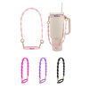 A drink bottle with a light pink silicone flower tumbler strap. Additional straps in pink, purple, and black are displayed.