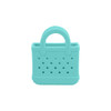 A mini turquoise EVA bag charm featuring a textured surface and handle with holes for attachment.