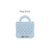 A light blue mini EVA bag charm with perforations and a handle, featuring a logo on the front.