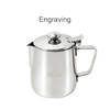 A stainless steel milk frothing pitcher with a lid, featuring a handle and a branded logo.