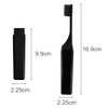 A foldable travel toothbrush in black, displayed in both folded and extended positions, with dimensions noted.