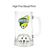 A clear glass beer mug featuring a soccer-themed design and a custom spinner toy inside.
