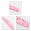 A pink sponge half moon shape nail file with a smooth surface and colourful design on one side.