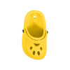 A yellow paw-shaped clog shoe fridge magnet with ventilation holes and a black button detail.