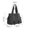 A lightweight tote bag in dark grey with adjustable yoga mat straps and multiple pockets. It has a logo on the front.