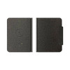 A black passport holder with a textured finish and a built-in tracking tag. It features a logo on the front.