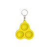 A yellow keychain featuring three pop bubbles, attached to a metal ring.