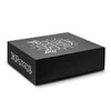 A large black gift box with a magnetic lid featuring a design and a logo.
