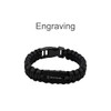 A black paracord bracelet featuring a metal plate and a clasp, suitable for custom engraving.
