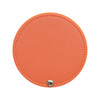 A round makeup mirror with an orange textured surface and a silver snap closure. It features a simple, sleek design.