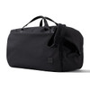 A black duffel bag with handles and an adjustable strap, featuring a small logo on the side.