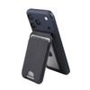 A magnetic wallet in black, attached to a navy phone, featuring a phone stand and storage for cards.