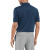 A men's navy polo shirt with short sleeves and a collar, featuring a logo on the back.