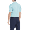 A men's short-sleeve polo shirt in light blue, featuring a subtle strip and a collar, with a dark background.
