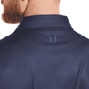 A navy blue polo shirt featuring a subtle dot print and a logo on the back collar.