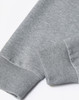 A grey unisex crew neck sweater displayed at an angle, highlighting the cuff detail. The fabric appears soft and textured.
