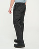 Black lightweight nylon waterproof rain pants with an elastic waist and side pockets, featuring a logo.