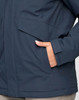 A unisex quilted waterproof jacket in navy blue, featuring a pocket and a close-up of the material.