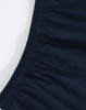 A close-up of unisex mercerised cotton shorts in navy, featuring an elastic waistband. The image includes branding.