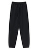 Black unisex sweatpants with an elastic waistband and side pockets, featuring a logo.
