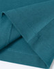 A close-up of a teal men's premium cotton t-shirt, highlighting the fabric and stitching details.