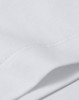 A close-up view of a white cotton t-shirt, showcasing its fabric texture and stitching details.