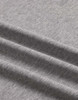 A close-up of a grey premium cotton T-shirt fabric, featuring a soft, textured finish and gentle folds.
