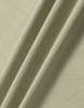 A close-up of soft, folded fabric in a muted green shade. The material has a smooth texture.