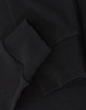 A black long-sleeve tee shirt with a close-up of the sleeve and cuff detailing. It features a logo.