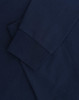 A navy blue long-sleeve T-shirt with folded sleeves and a subtle logo.