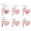 A heart-shaped compact mirror in pink features a keychain, with options for digital print and debossing designs.