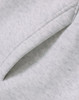A close-up of a soft, grey fleece fabric featuring a folded edge, showcasing the texture.
