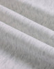 A close-up of soft, grey fabric showing a textured, fleece surface with subtle variations.