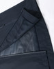 A waterproof jacket in navy, featuring zippered pockets and mesh lining. It includes a logo.