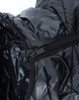 A black lightweight hooded puffer jacket featuring a zipper and a smooth interior lining. It has a branding logo visible.