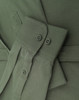 A close-up of a men's smart casual cotton blend long-sleeve shirt in olive green, featuring button details and cuffs.