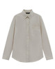 A beige long-sleeve shirt with a collar and a chest pocket, featuring a logo on the tag.