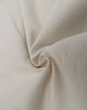 A textured light beige fabric, featuring a smooth and soft cotton blend suitable for shirt design.