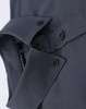 A close-up of a grey cotton blend long-sleeve shirt featuring button details and a collar.
